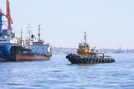 Trade port, Baku, Azerbaijan - March 29, 2017. Fire the ship enters the port.のeditorial素材