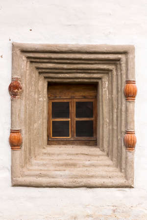 Small Windows in the wall of an ancient monastery. Kirillo-Belozersky monastery.の写真素材