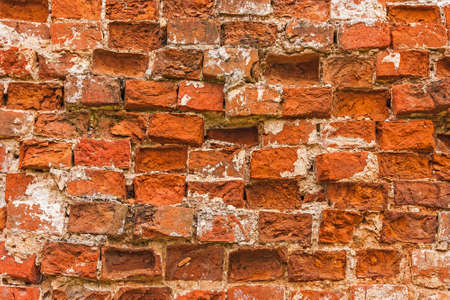 The laid rows of bricks in an ancient monastery wall. Close-up.