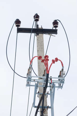 Supports of power lines. Power lines and posts. Detailed close-up.の写真素材
