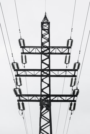 Supports of power lines. Power lines and posts. Detailed close-up.