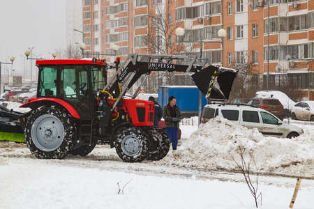 Michael Lunn Street, Balashikha, Russia-January 23, 2021. Mechanized cleaning of fallen snow with the help of harvesting equipment.のeditorial素材