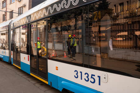Central District, Moscow, Russia - March 28, 2021. Moscow tram. Urban electric transport in Moscow. The modern Moscow tram passes through the arch.のeditorial素材