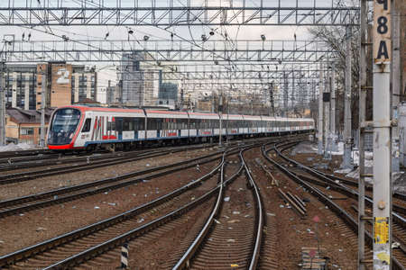 Kursky Railway Station, Moscow, Russia - March 28, 2021. Moscow electric train. Urban electric transport in Moscow. Train at the Kursk railway station.のeditorial素材