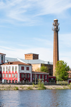 Balashikha, Cotton Spinning factory - May 09, 2018. The chimney of a cotton mill. The chimney is an atmospheric pollutant. Pipe emissions pollute the environment.のeditorial素材