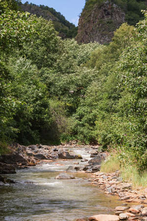 Mountain road close-up. Nature background with road close-up. Idyllic landscape with the Elbrus mountains. Chegem Gorge, Kabardino-Balkaria, Russiaの写真素材