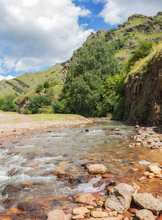 Mountain road close-up. Nature background with road close-up. Idyllic landscape with the Elbrus mountains. Chegem Gorge, Kabardino-Balkaria, Russiaの写真素材