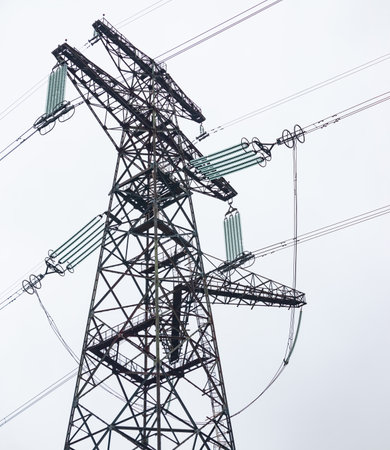 Metal support with high voltage insulators against the sky in the autumn. energy industry. Production, distribution and transmission of electricity. power lines. power substance.の写真素材