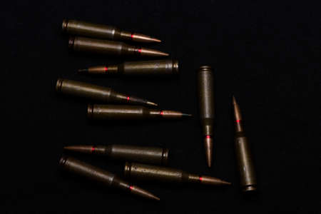 Rifle military ammo on black background. Symbolizes war for money- biggest problem in world.