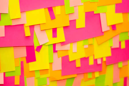 Bright multi-colored stickers on the office white board.