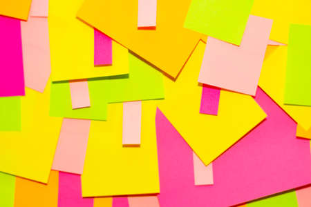 Bright multi-colored stickers on the office white board.
