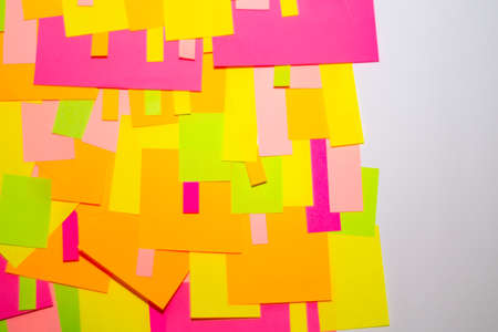 Bright multi-colored stickers on the office white board.の写真素材