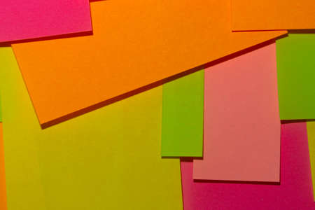 Bright multi-colored stickers on the office white board.の写真素材