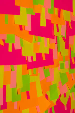 Bright multi-colored stickers on the office white board.