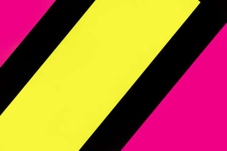 Yellow and purple hue colorful office stickers on black paper. Office noteparer as reminder. Isolated on black paper.の写真素材