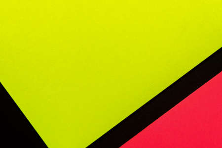 Yellow and rose hue colorful office stickers on black paper. Office noteparer as reminder. Isolated on black paper.の写真素材