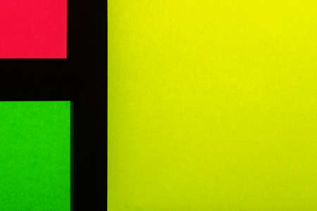 Green, yellow and rose hue colorful office stickers on black paper. Office noteparer as reminder....