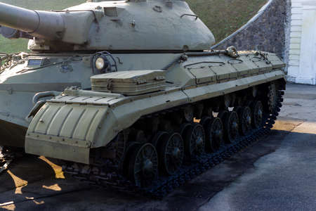 Parts of the hull of the old tank in the museum of military vehicles outdoor in the open air. Gun...
