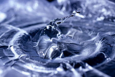 Water drops splashing on acoustic membrane. A lot of drops in air. High frequency of sound waves....