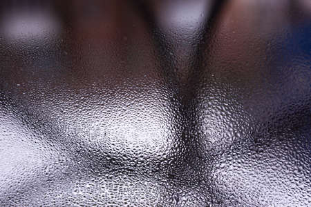 Water drops on glass window close up with blurred background. Drops in macro. Condensate on window...