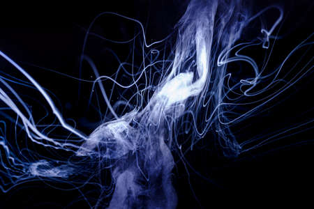 Vape smoke clouds isolated on black background. Hot vape liquid splash in vape coil. Nice aromatic...