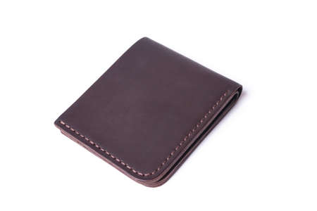 Brown handmade leather man wallet isolated on white background. Wallet is closed. Stock photo of...