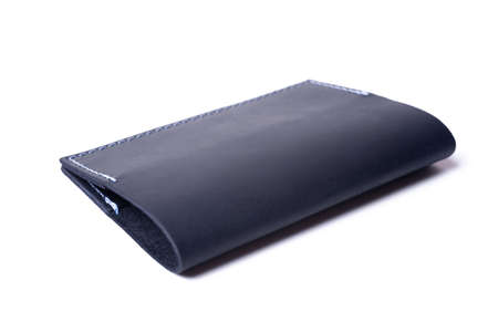 Blue handmade leather passport cover isolated on white background. Cover is closed. Stock photo of...