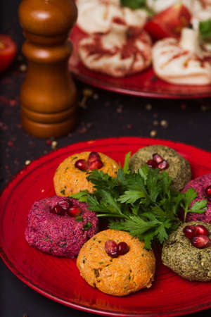 Georgian food on black table. khinkali, phali and adjika.の写真素材