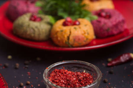 Georgian food on black table. Phali and adjikaの写真素材