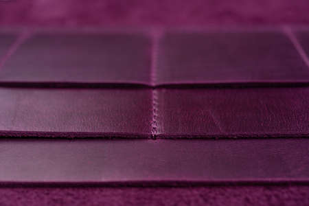 Purple handmade leather wallet details closeup. Pockets for cards, hue picture.の写真素材