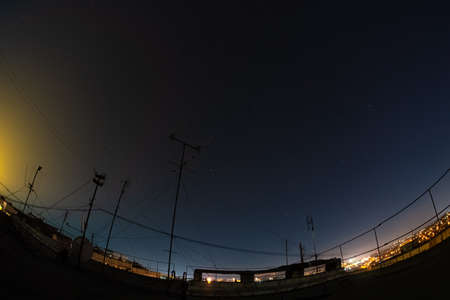 Night starry sky city view from roof high rise building fisheye