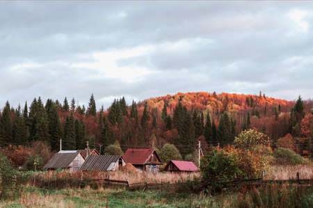 Autumn view of the village, North of Russia, in the light of the sunsetの写真素材