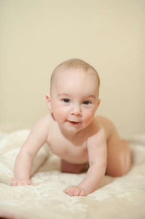 The little boy newborn baby smiling and drooling creeps and lies, Sleepsの写真素材