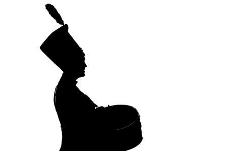 silhouette of a girl Hussar army drummer isolated on white backgroundの写真素材