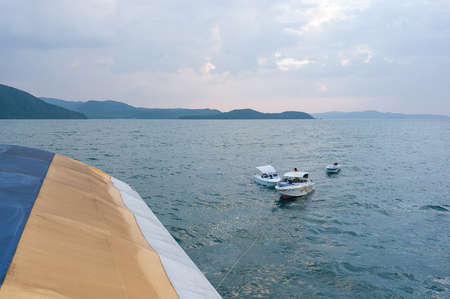 the boat is towed on a summer vacation on a tropical beach vacationの写真素材