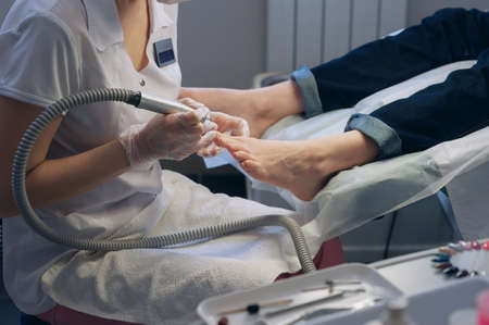 A professional technician grinding machine, nail polish, professional nail care the hands and feetの写真素材