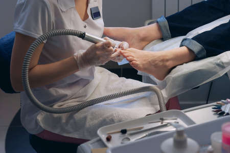 A professional technician grinding machine, nail polish, professional nail care the hands and feetの写真素材