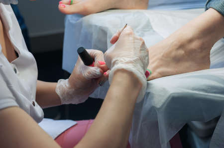 A professional technician grinding machine, nail polish, professional nail care the hands and feetの写真素材