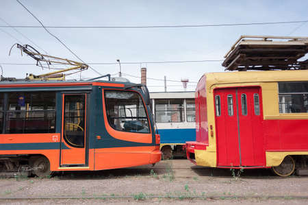Trams new and old, are in a park, ready to travel the route. past and futureの写真素材