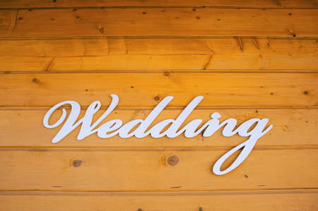 Wedding Ceremony sign on the wall of a wooden houseの写真素材