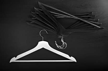 White hanger and a few black hangers, background, abstractの写真素材