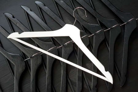 White hanger and a few black hangers, background, abstractの写真素材