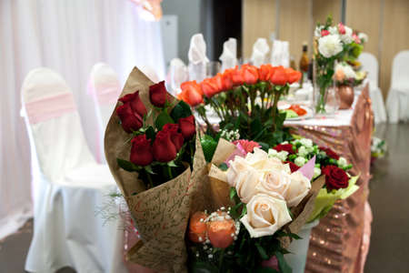 a bouquet a white rose among pink onesの写真素材