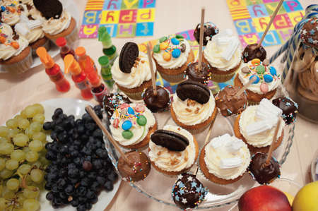 portrait of table set up for child's party with white brick wall on the background.の写真素材