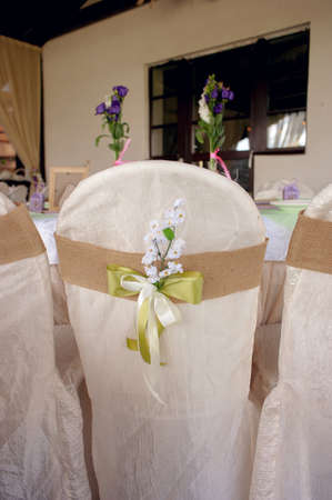 Beautifully decorated table for the wedding ceremony. Served banquet table decorated with fresh flowers in the open air.の写真素材