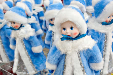 A lot of figurines of the Snow Maiden are on sale, on the counter in the store. Christmas decorationsの写真素材
