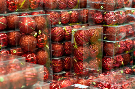 Christmas balls are red, on the supermarket counter. Toys in Saleの写真素材