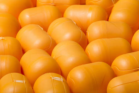 Yellow kinder egg Toy Box on a wooden background.の写真素材