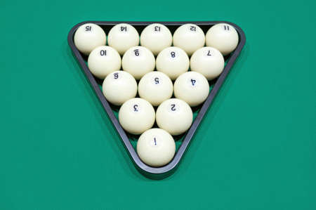 White billiard balls for Russian billiards, in a triangle on the table