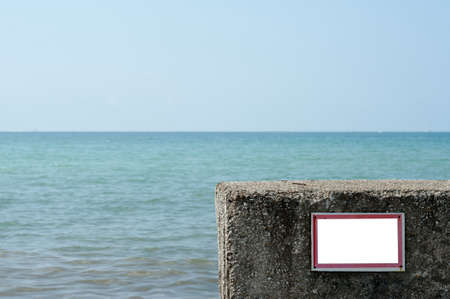 Prohibiting empty insulated sign installed on the pebble beach of the pier.の写真素材